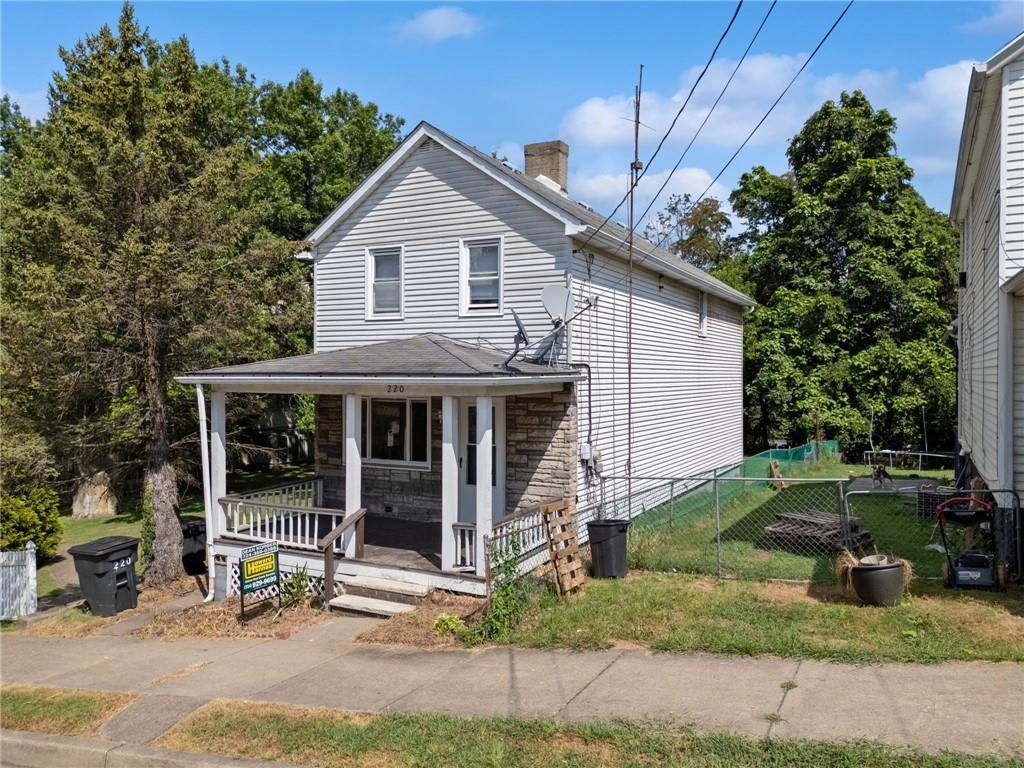 a view of a house with a yard and plants