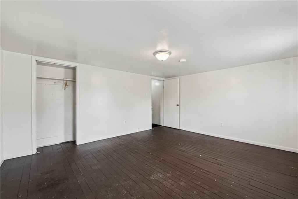 220 Oneida Street Monessen, PA 15062 - Photo 18 of 28 a view of an empty room with wooden floor