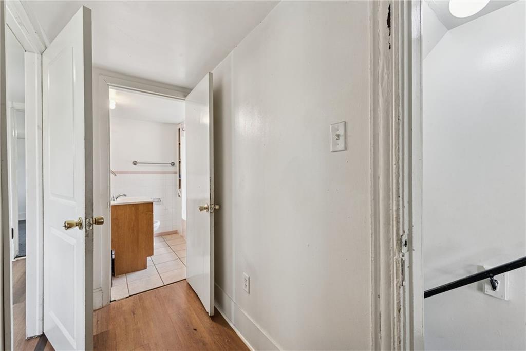 220 Oneida Street Monessen, PA 15062 - Photo 19 of 28 a view of a hallway with wooden floor