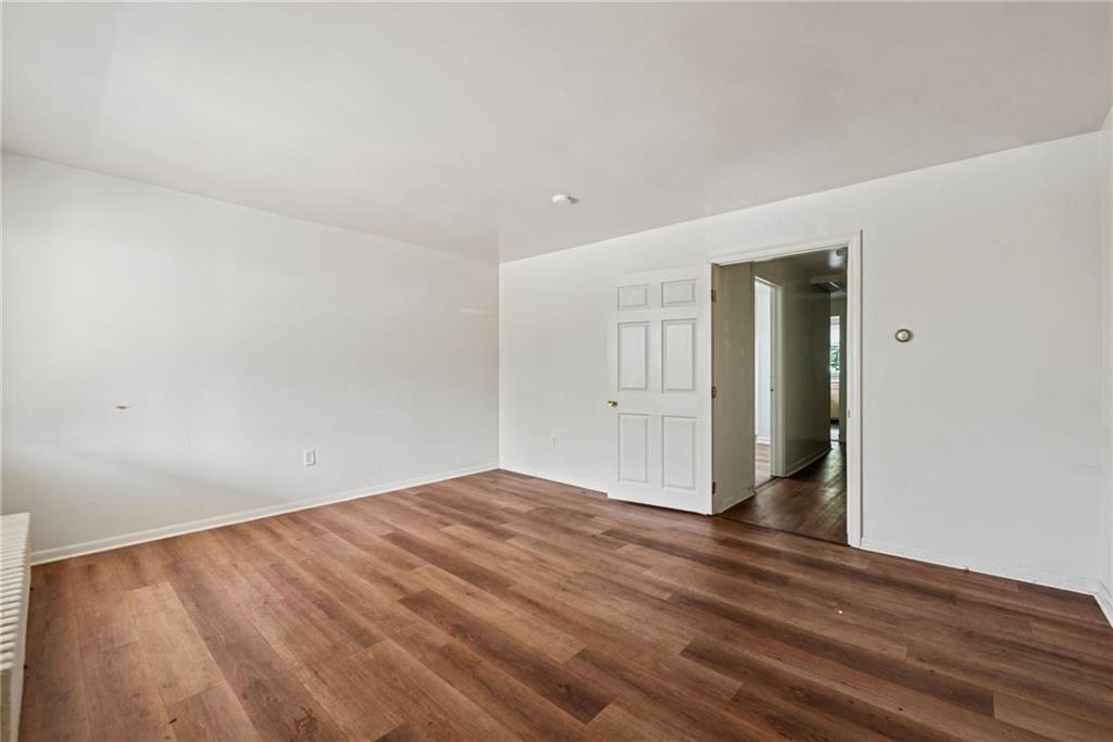 220 Oneida Street Monessen, PA 15062 - Photo 10 of 28 a view of empty room with wooden floor