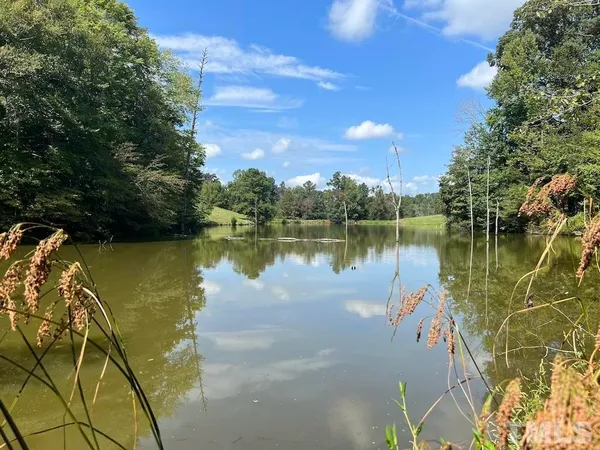 a view of a lake with a yard