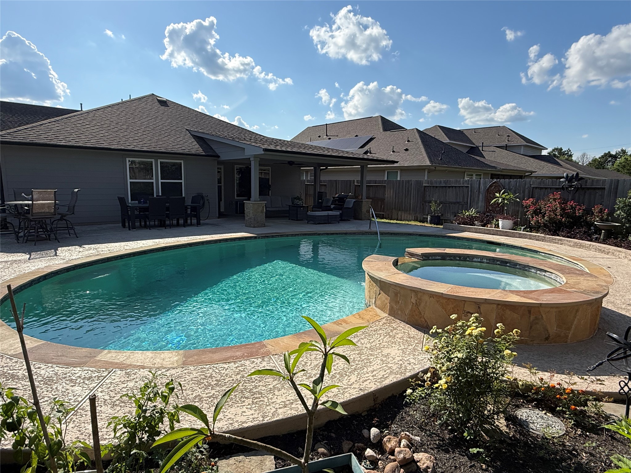 2336 Hagerman Road Conroe, TX 77384 - Photo 29 of 35 a front view of a house with swimming pool garden and patio