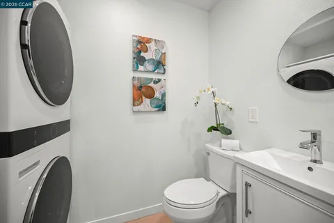 a white toilet sitting next to a bathroom sink