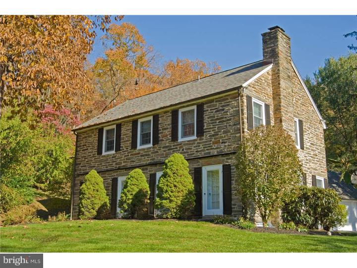 1 Rose Hill Road Media, PA 19063 - Photo 2 of 24 a front view of a house with a garden