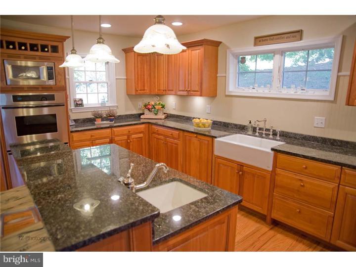 1 Rose Hill Road Media, PA 19063 - Photo 12 of 24 a kitchen with stainless steel appliances granite countertop a sink stove and window