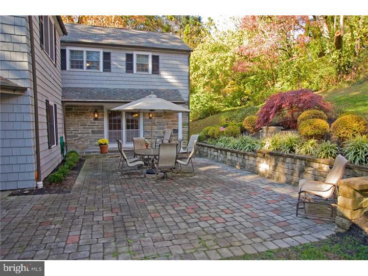 1 Rose Hill Road Media, PA 19063 - Photo 16 of 24 a backyard of a house with table and chairs