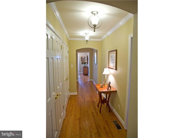 1 Rose Hill Road Media, PA 19063 - Photo 17 of 24 a view of a hallway with furniture and wooden floor