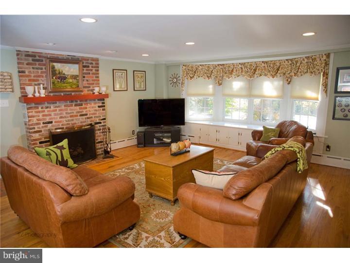 1 Rose Hill Road Media, PA 19063 - Photo 18 of 24 a living room with furniture a large window and a flat screen tv
