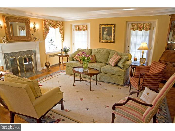 1 Rose Hill Road Media, PA 19063 - Photo 7 of 24 a living room with furniture a fireplace and a large window