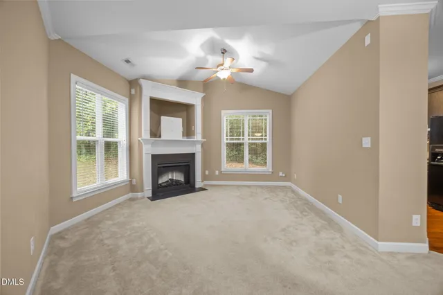a view of a livingroom with a chandelier fan