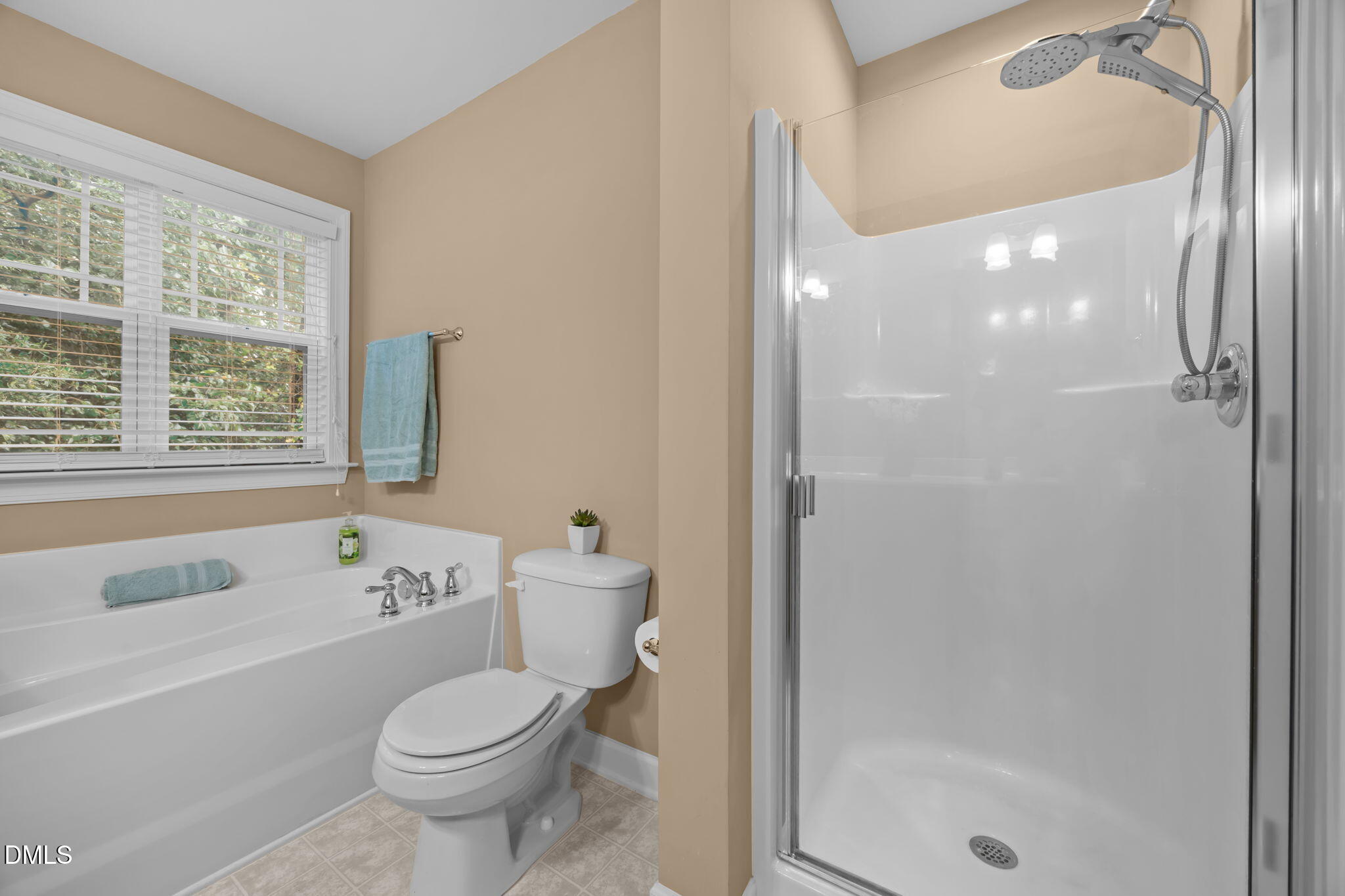1929 Fieldhouse Avenue Raleigh, NC 27603 - Photo 15 of 29 a bathroom with a bathtub toilet and shower
