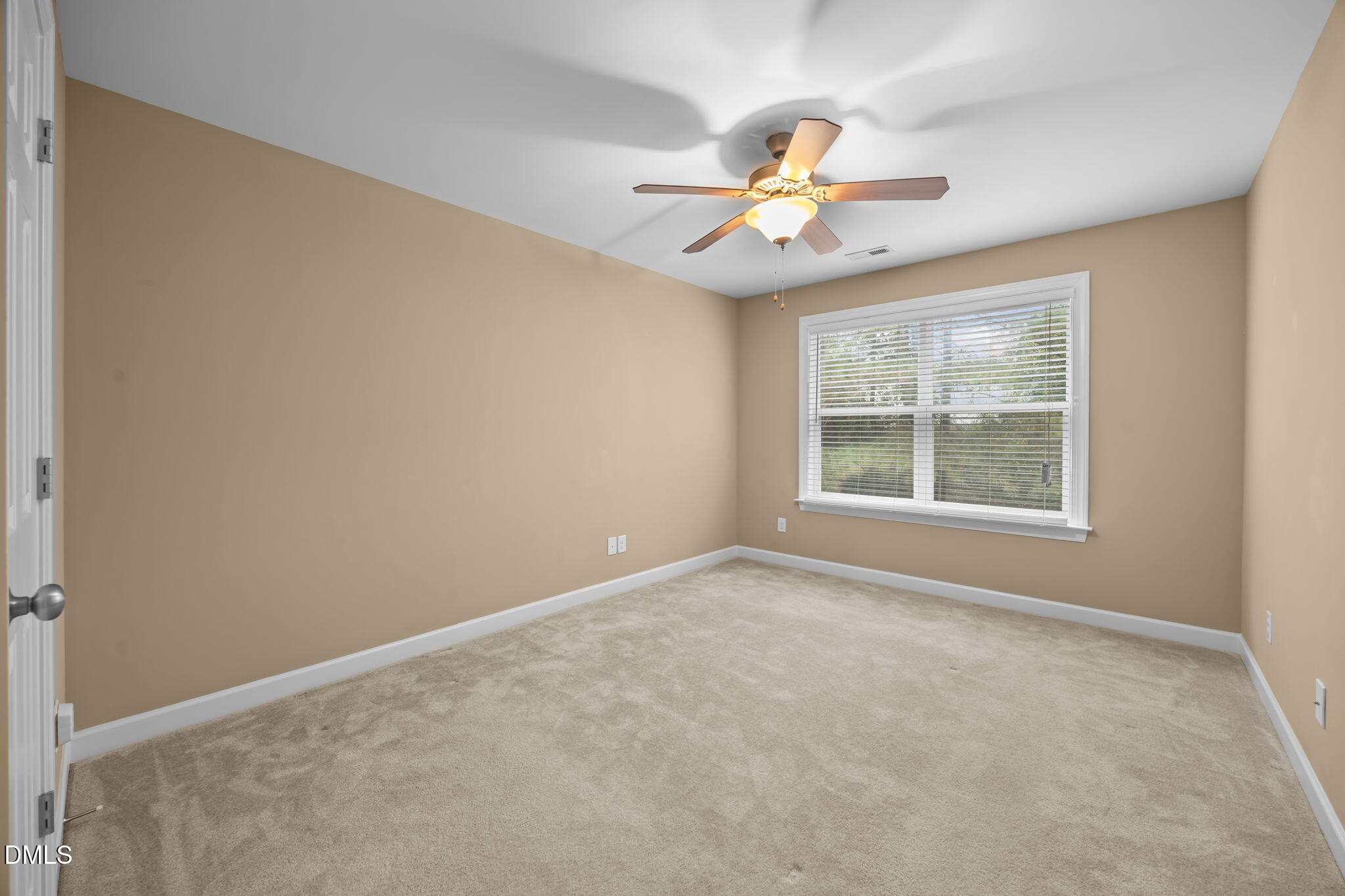 1929 Fieldhouse Avenue Raleigh, NC 27603 - Photo 17 of 29 an empty room with windows and fan