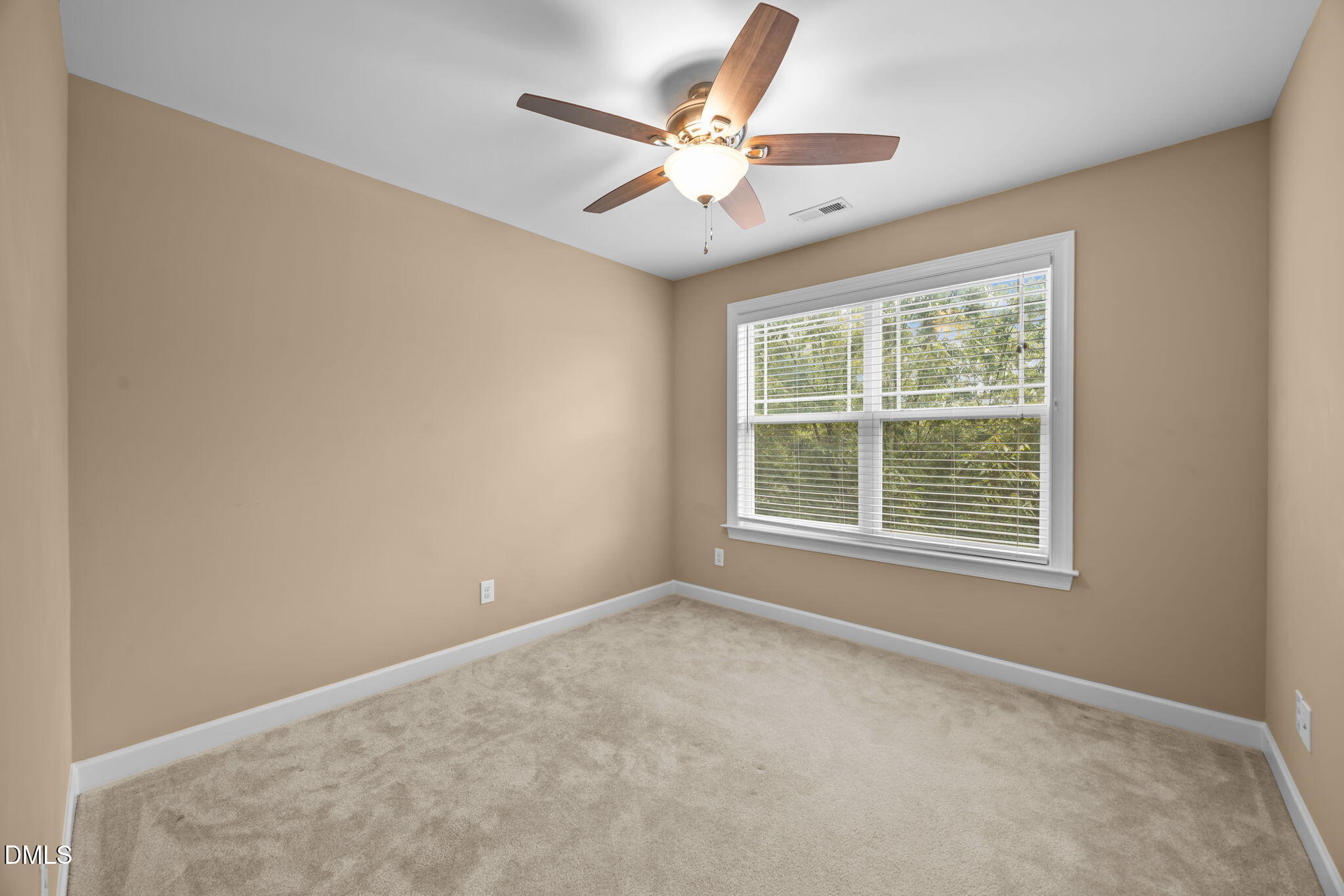 1929 Fieldhouse Avenue Raleigh, NC 27603 - Photo 21 of 29 an empty room with window and ceiling fan