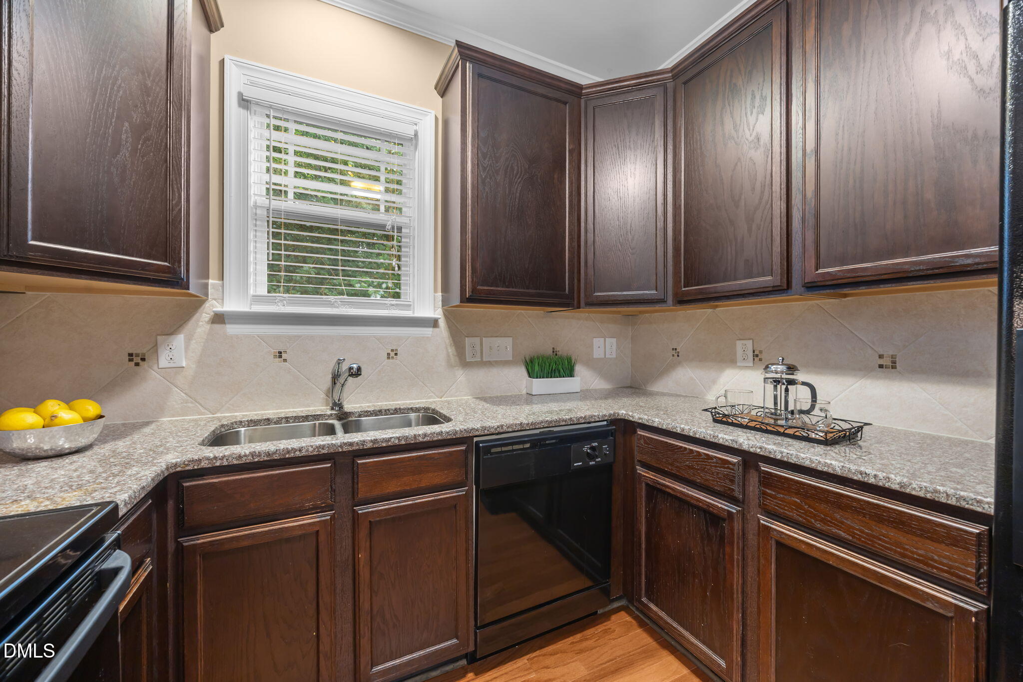 1929 Fieldhouse Avenue Raleigh, NC 27603 - Photo 4 of 29 a kitchen with granite countertop stainless steel appliances a sink stove and cabinets