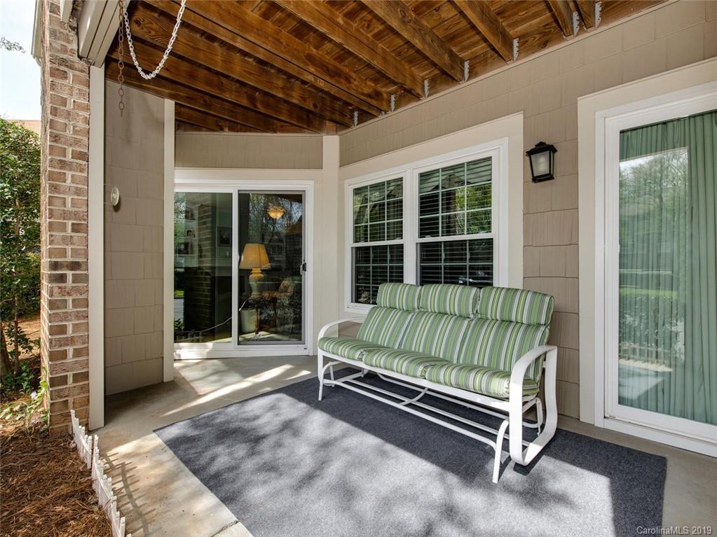 5009 Sharon Road Charlotte, NC 28210 - Photo 15 of 16 a view of backyard with a large window and couch