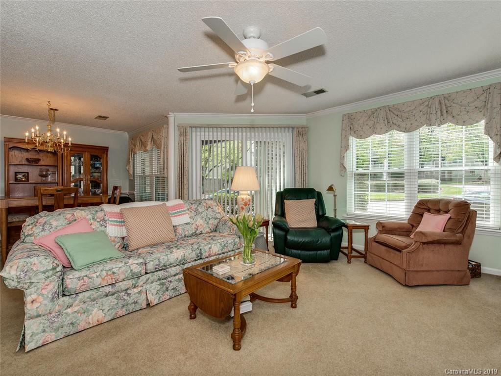 5009 Sharon Road Charlotte, NC 28210 - Photo 5 of 16 a living room with furniture and a large window