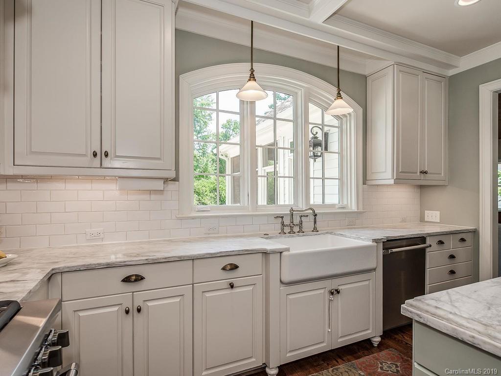 1114 Andover Road Charlotte, NC 28211 - Photo 12 of 44 a kitchen with a sink cabinets and window