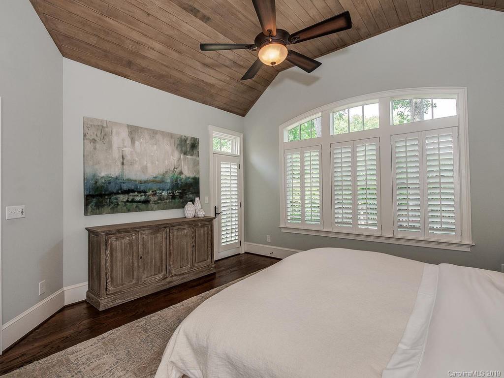 1114 Andover Road Charlotte, NC 28211 - Photo 20 of 44 a bedroom with a large bed and a large window