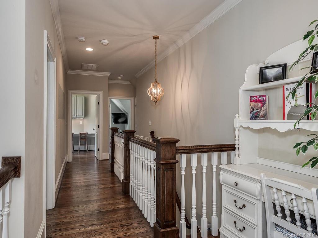 1114 Andover Road Charlotte, NC 28211 - Photo 27 of 44 a view of a hallway with wooden floor and staircase