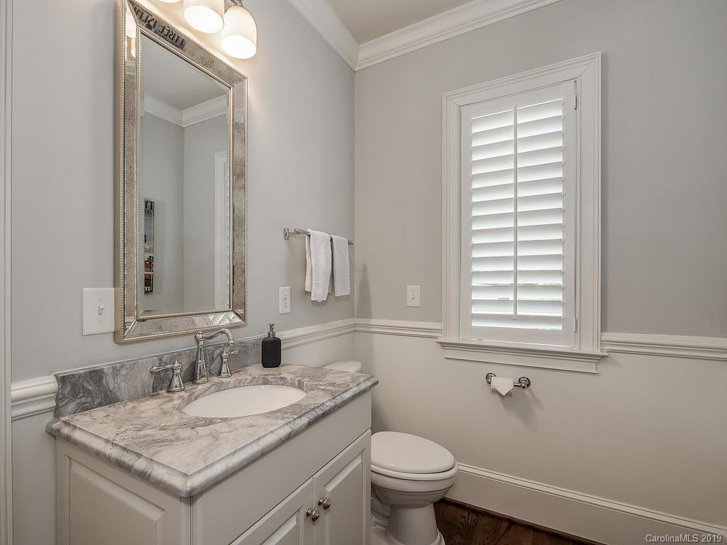 1114 Andover Road Charlotte, NC 28211 - Photo 29 of 44 a bathroom with a granite countertop sink and a mirror