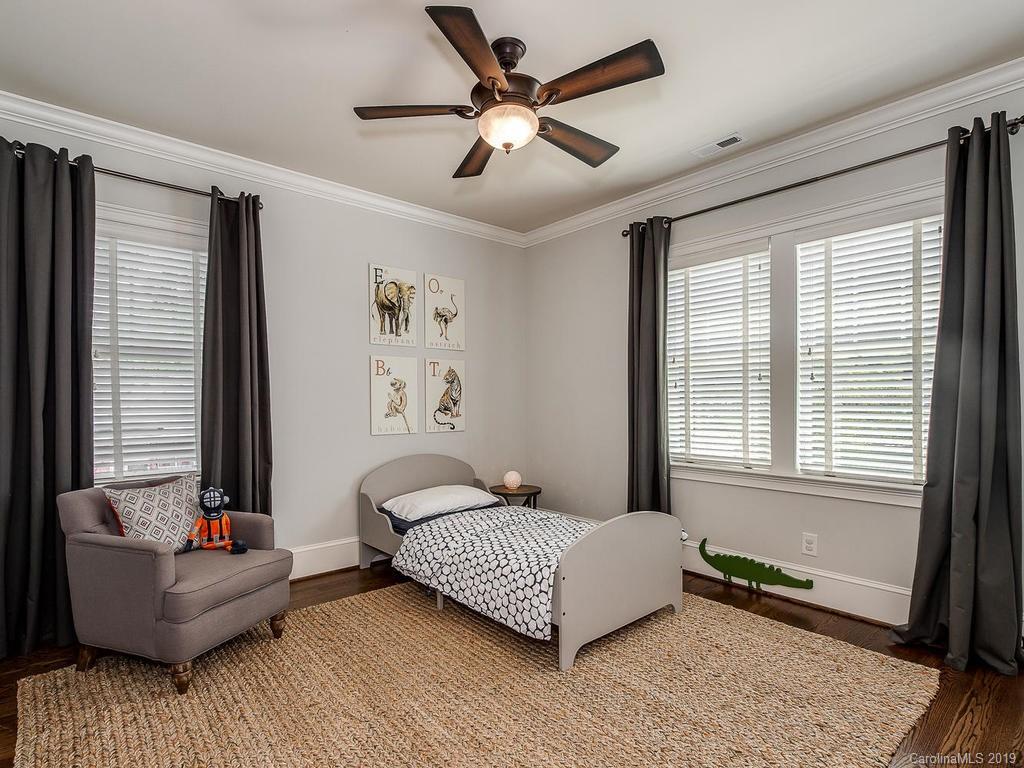 1114 Andover Road Charlotte, NC 28211 - Photo 32 of 44 a bedroom with a bed couch and window