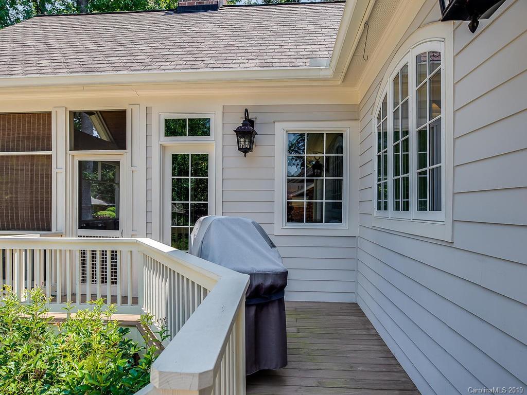 1114 Andover Road Charlotte, NC 28211 - Photo 40 of 44 a view of deck with a chair and wooden floor