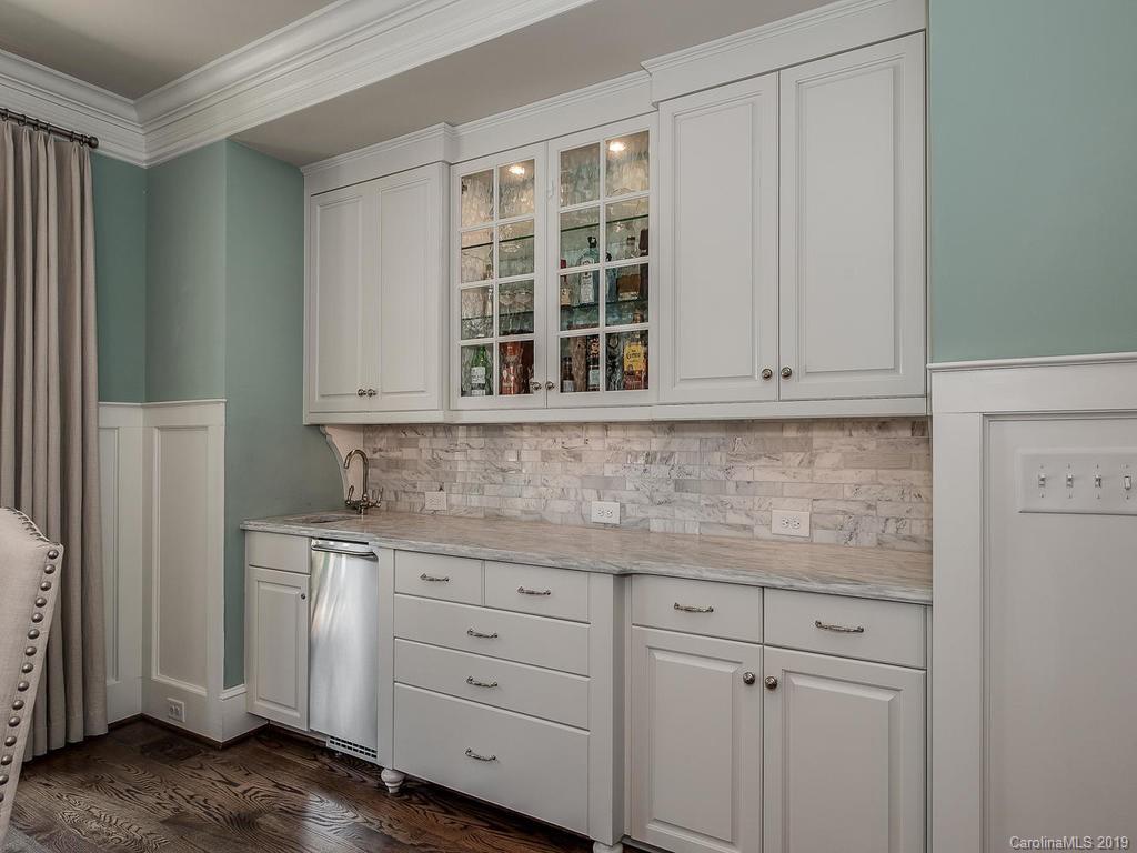 1114 Andover Road Charlotte, NC 28211 - Photo 6 of 44 a kitchen with granite countertop white cabinets and a sink