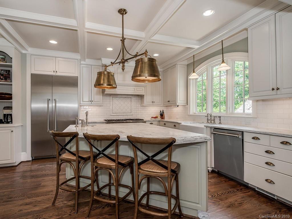 1114 Andover Road Charlotte, NC 28211 - Photo 10 of 44 a kitchen with stainless steel appliances granite countertop a sink a stove and a refrigerator