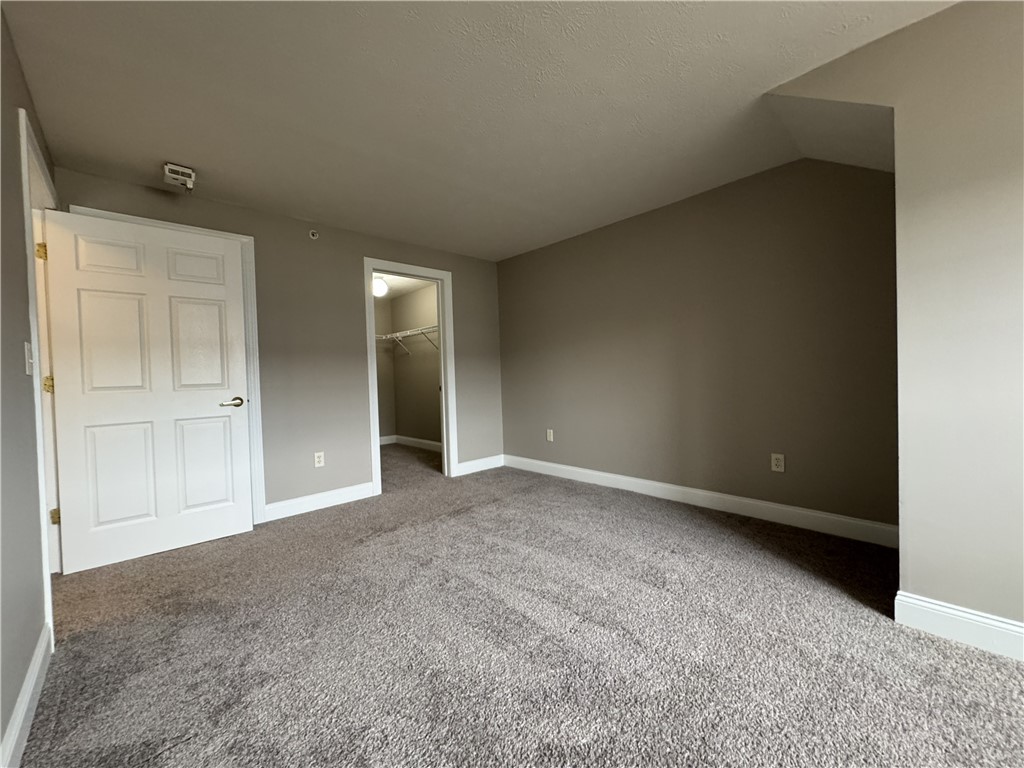 270 Exchange Boulevard, Unit 310 Rochester, NY 14608 - Photo 9 of 23 View of typical primary bedroom with walk in close