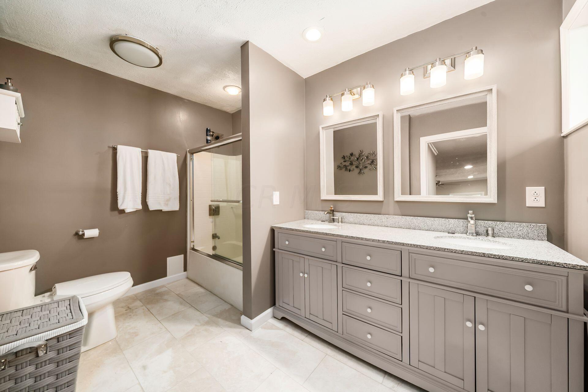4495 Avery Road Hilliard, OH 43026 - Photo 27 of 41 Remodeled in 2022.Approximately 11 1/2' x 7'.New vanity,mirrors,lights ,commode ,floor and paint