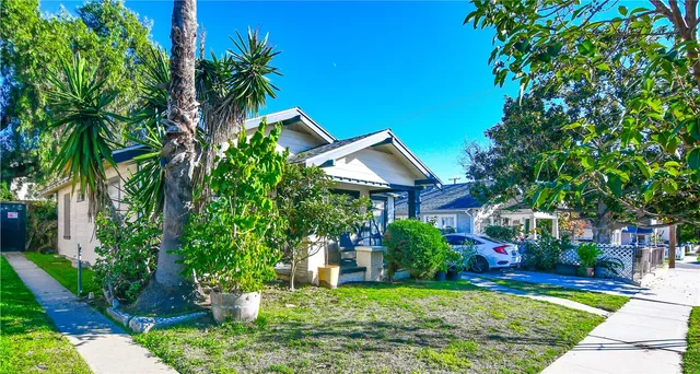 a house with a tree in front of it