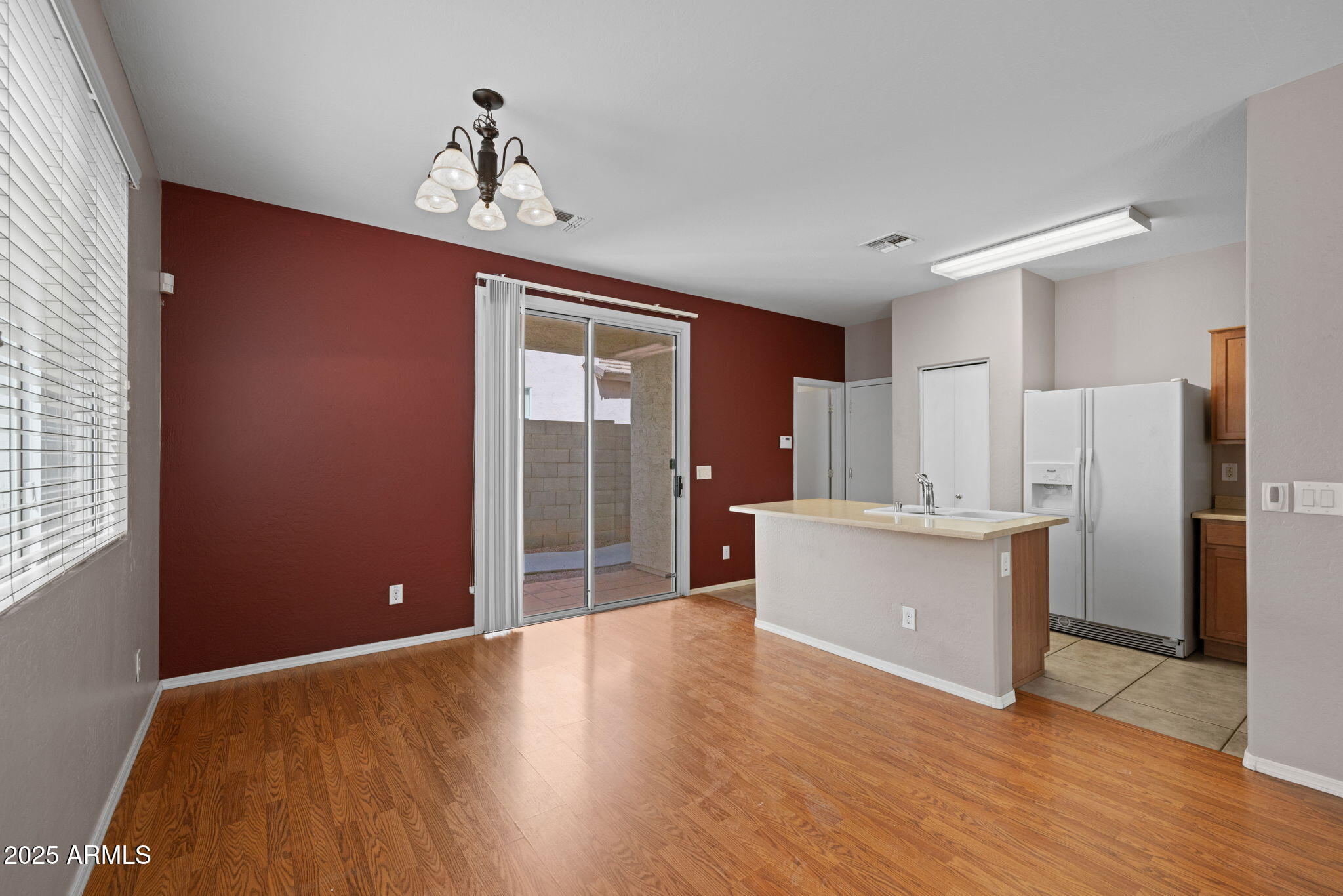5312 Fulton Street Phoenix, AZ 85043 - Photo 12 of 26 a view of kitchen with refrigerator stove and wooden floor