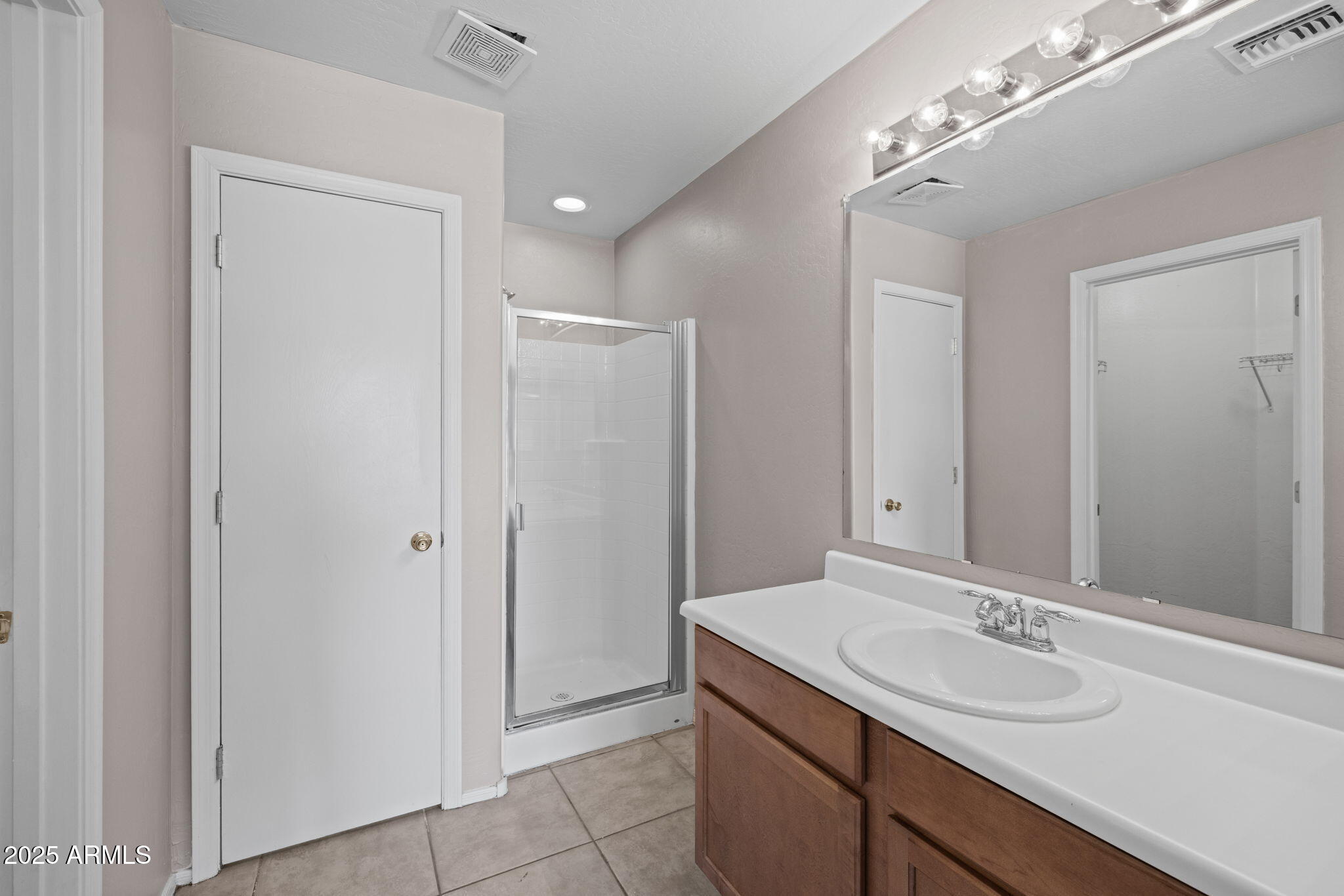 5312 Fulton Street Phoenix, AZ 85043 - Photo 19 of 26 a bathroom with a sink and a mirror