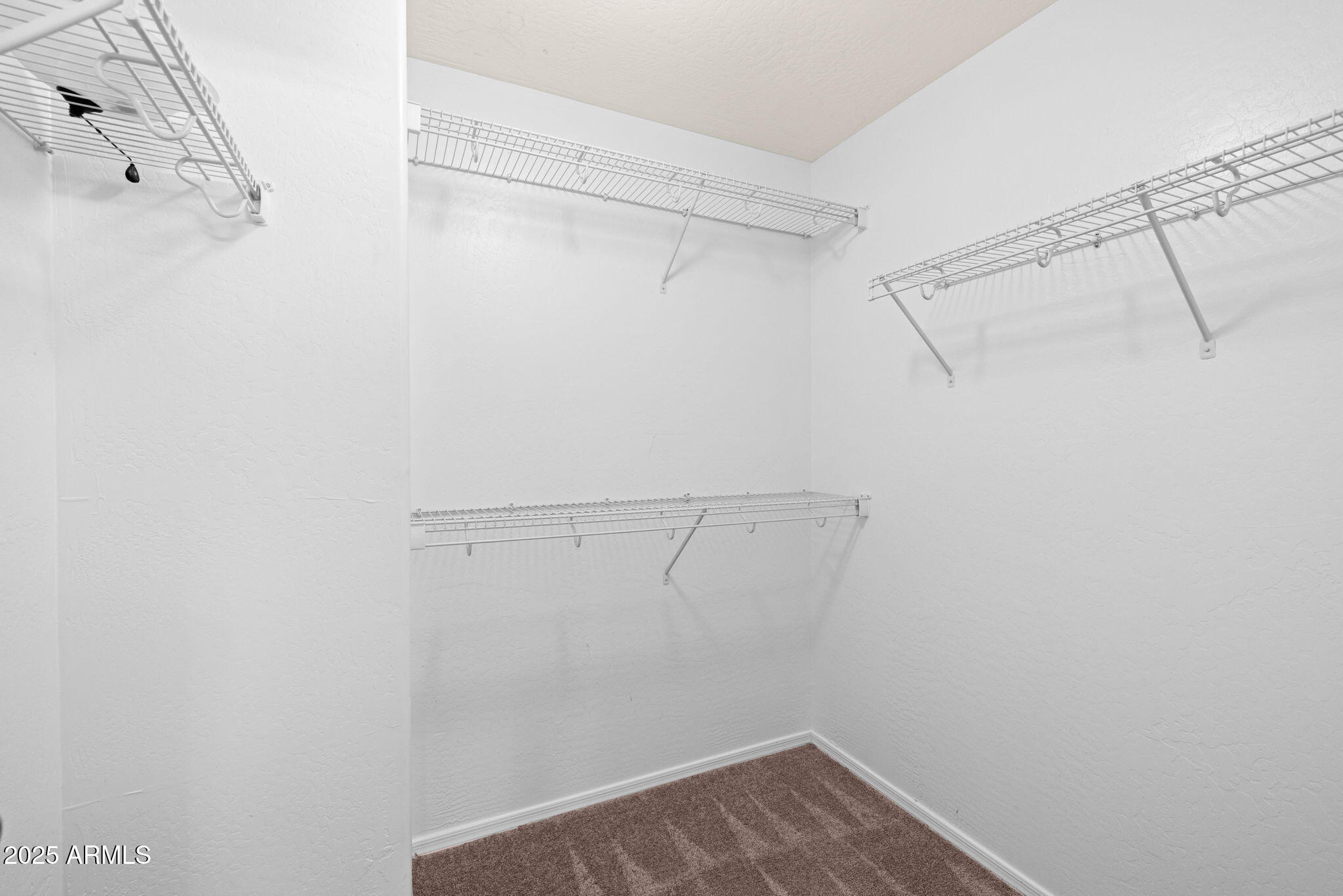 5312 Fulton Street Phoenix, AZ 85043 - Photo 21 of 26 a view of a room with racks on the wall