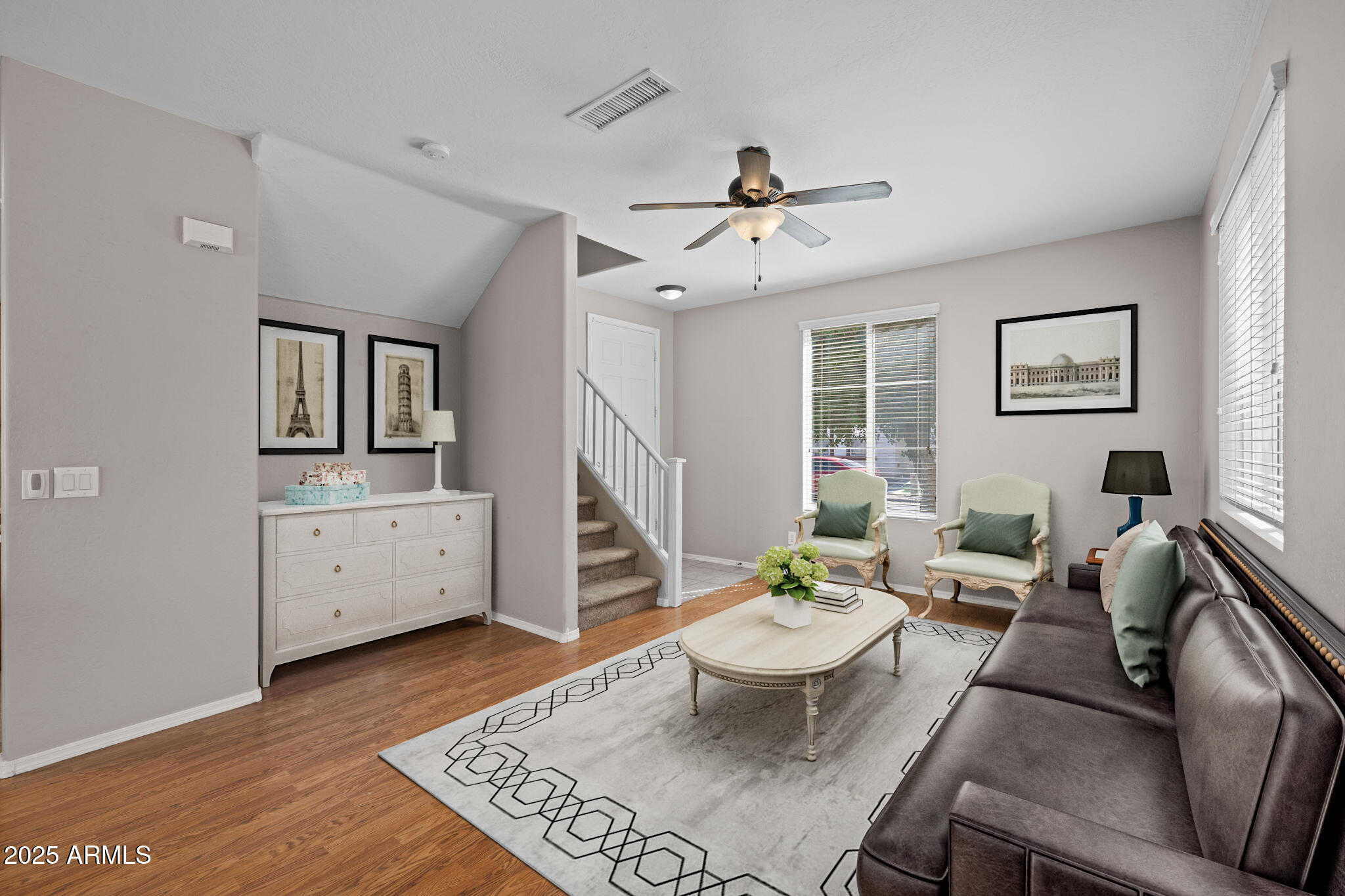 5312 Fulton Street Phoenix, AZ 85043 - Photo 4 of 26 a living room with furniture a dining table and a rug