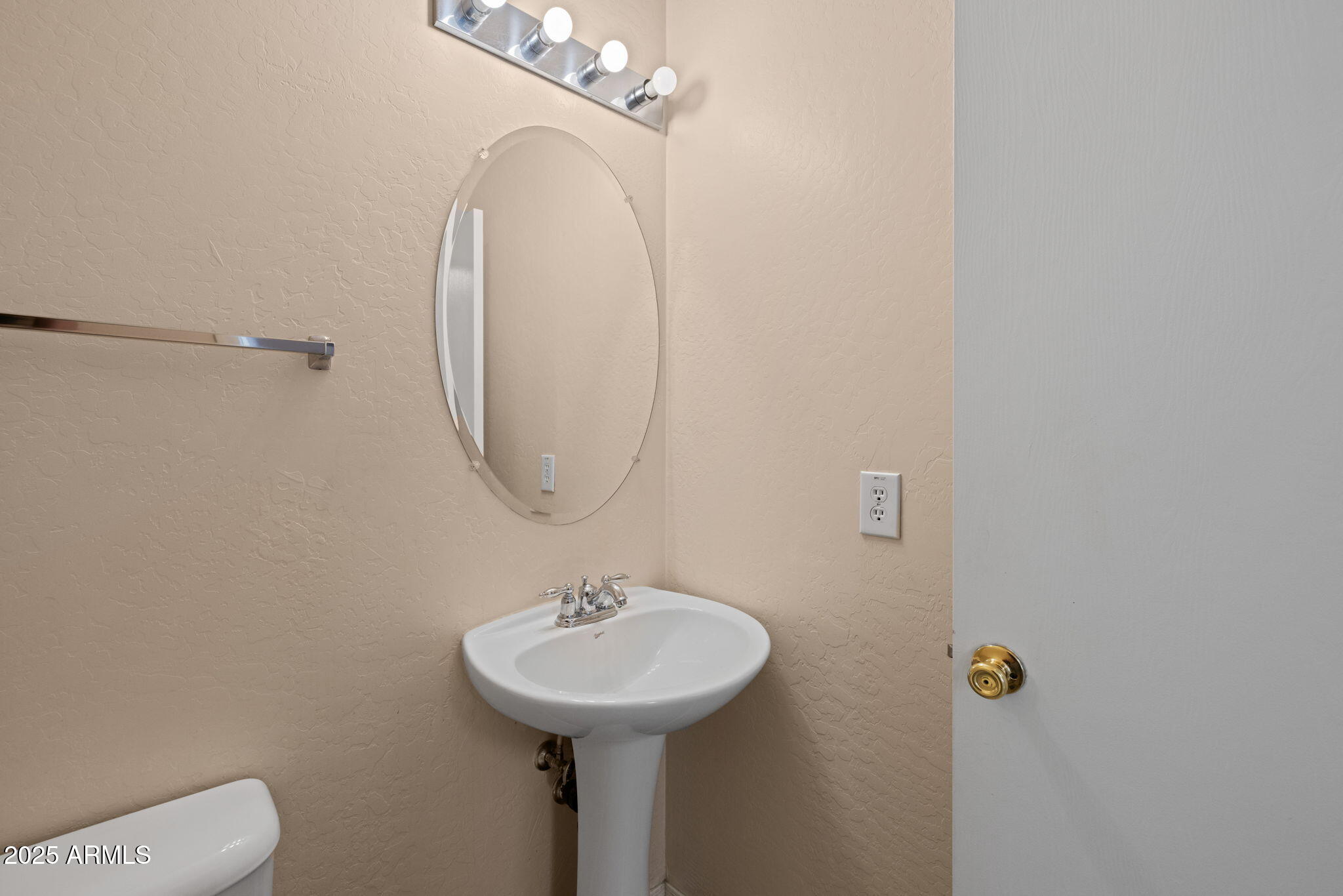 5312 Fulton Street Phoenix, AZ 85043 - Photo 7 of 26 a bathroom with a sink a mirror and toilet