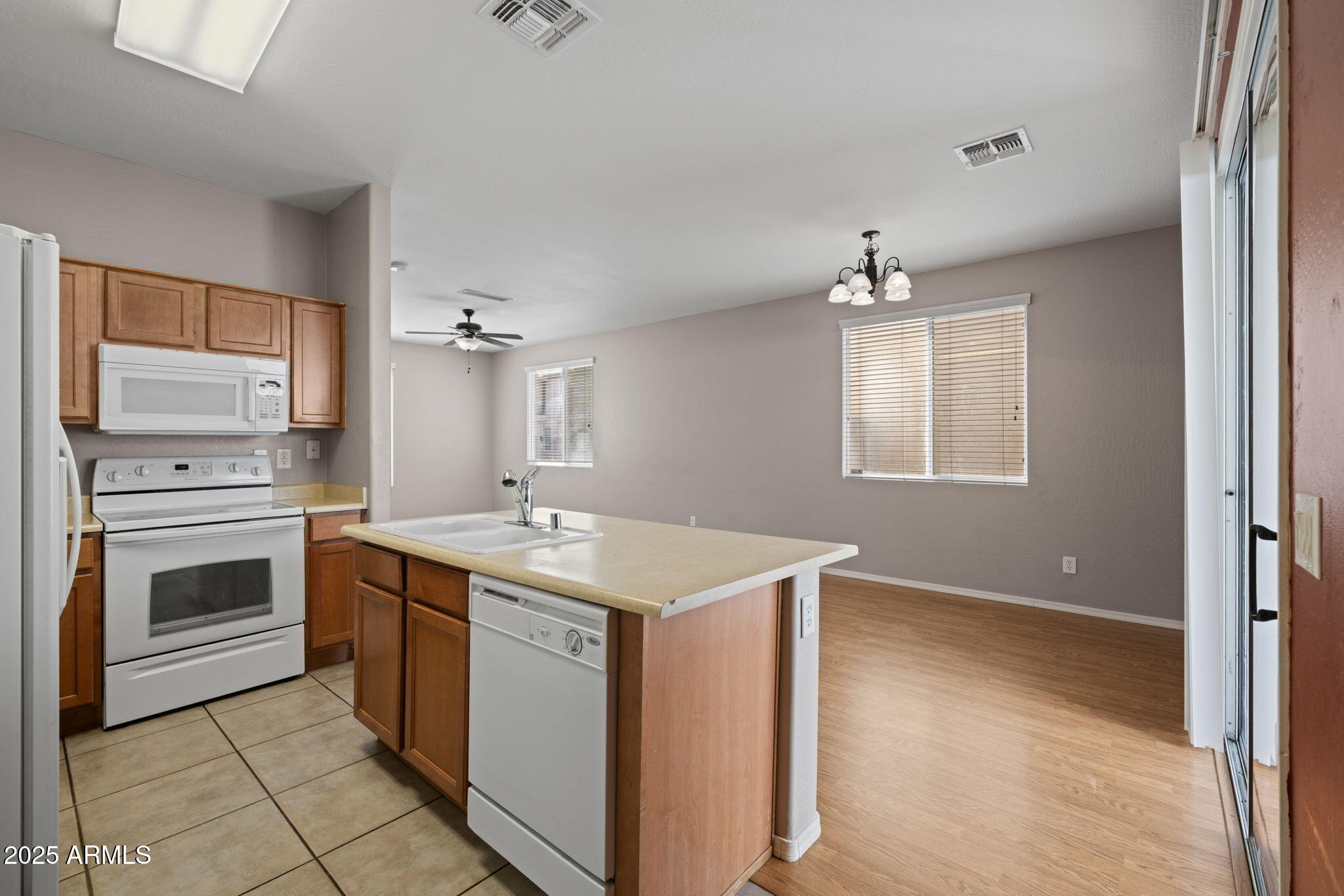 5312 Fulton Street Phoenix, AZ 85043 - Photo 9 of 26 a kitchen with a stove and a sink