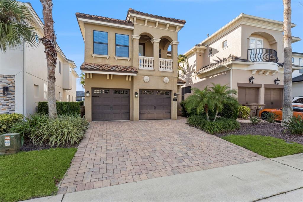 1176 Castle Pines Court Reunion, FL 34747 - Photo 1 of 1 a front view of a residential houses with yard and green space