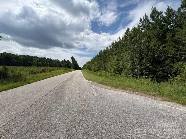 a view of a road with a big yard