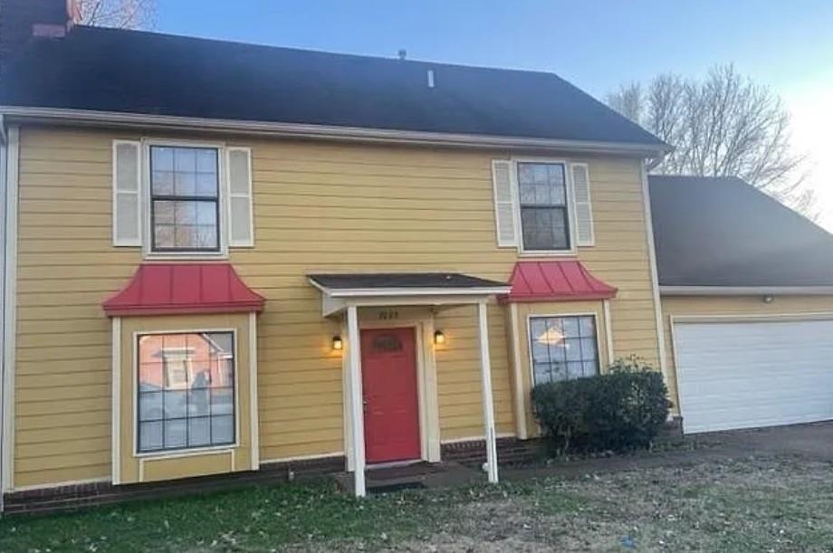 7605 Reese Road Memphis, TN 38133 - Photo 1 of 11 a view of a house with a backyard