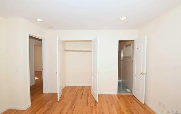a view of hallway with wooden floor