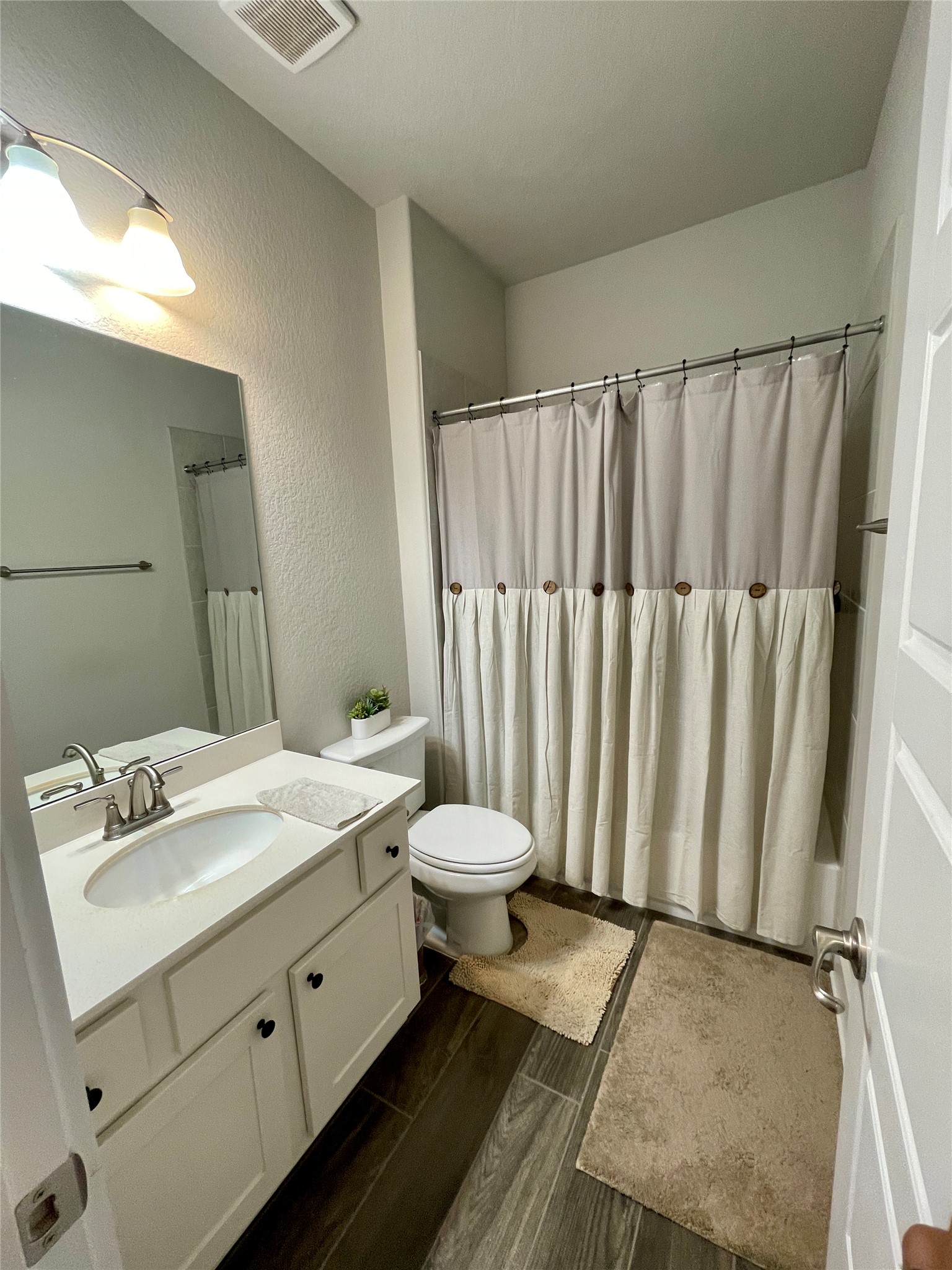 120 Sail Wind Way Georgetown, TX 78633 - Photo 13 of 25 a bathroom with a granite countertop sink and a mirror
