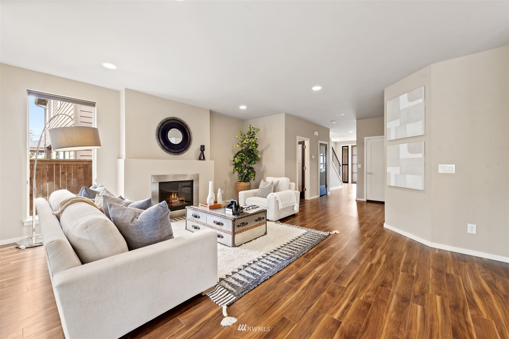 17007 40th Avenue Southeast Bothell, WA 98012 - Photo 5 of 26 a living room with furniture and a fireplace