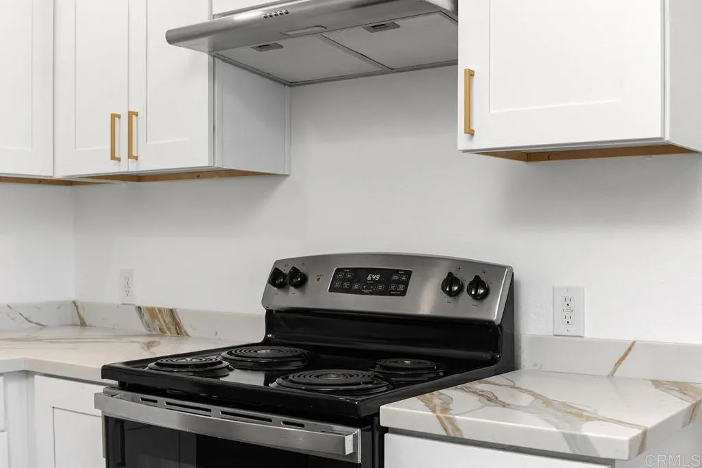 889 Bracero Road Encinitas, CA 92024 - Photo 39 of 59 a stove top oven sitting inside of a kitchen