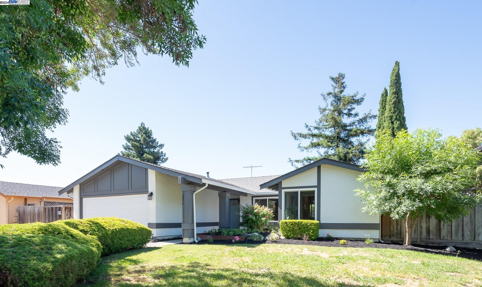 34017 Sylvester Drive Fremont, CA 94555 - Photo 1 of 1 a view of a house with a yard and potted plants