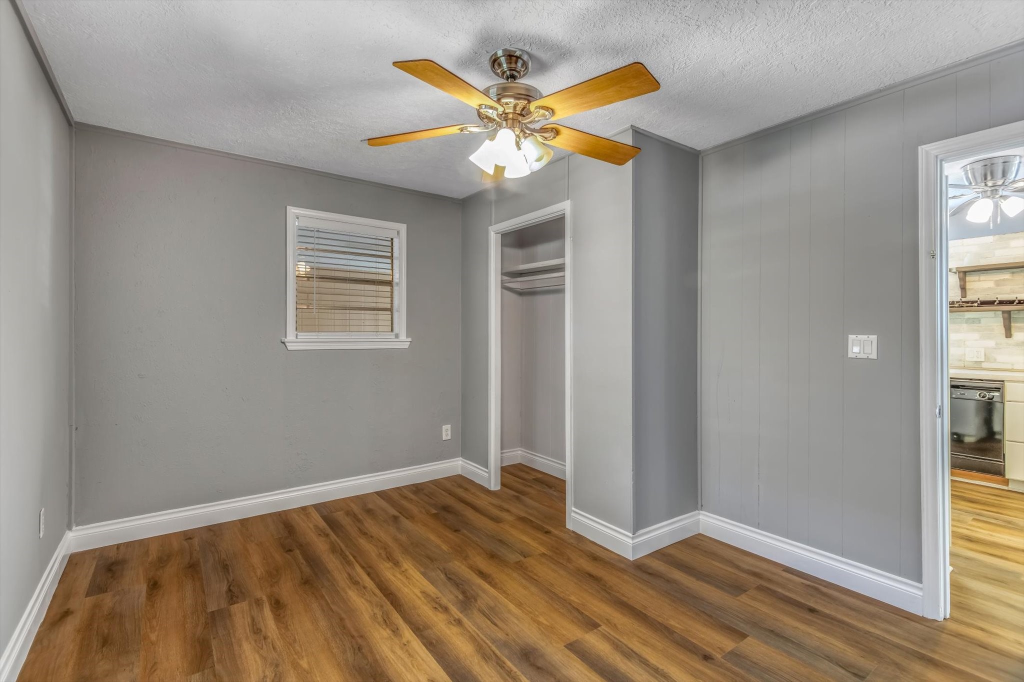 14752 Highway 146 Liberty, TX 77575 - Photo 17 of 31 a view of an empty room with wooden floor and a window