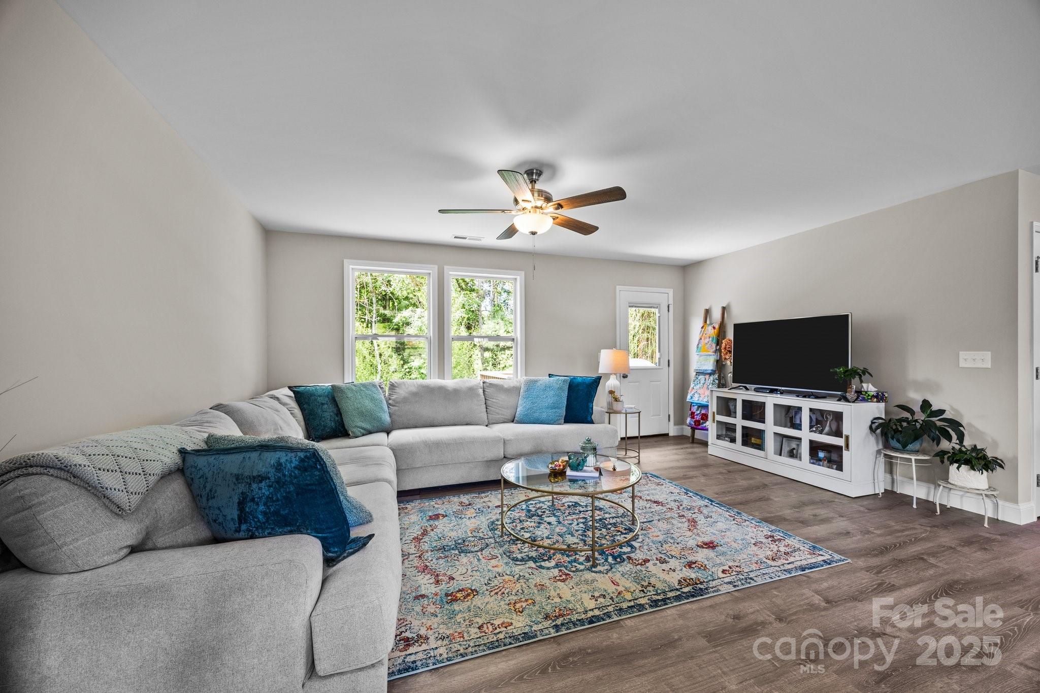 458 Summer Road Hendersonville, NC 28792 - Photo 11 of 29 a living room with furniture and a flat screen tv