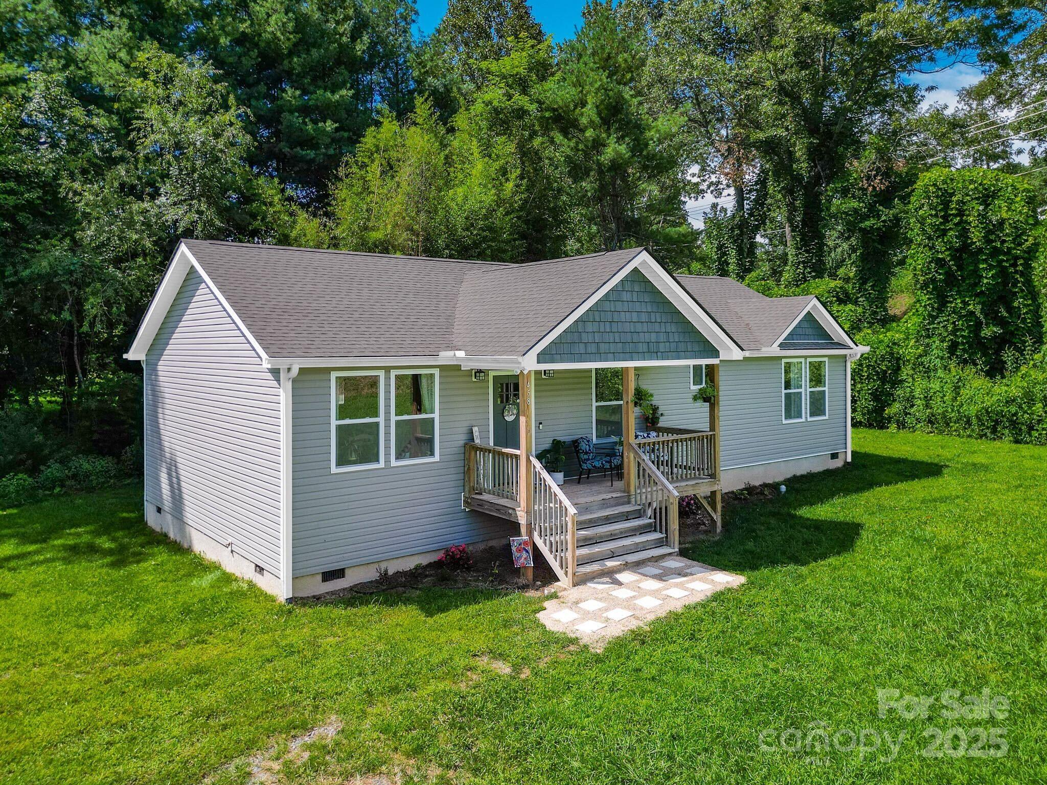 458 Summer Road Hendersonville, NC 28792 - Photo 2 of 29 a aerial view of a house with a yard chairs and table