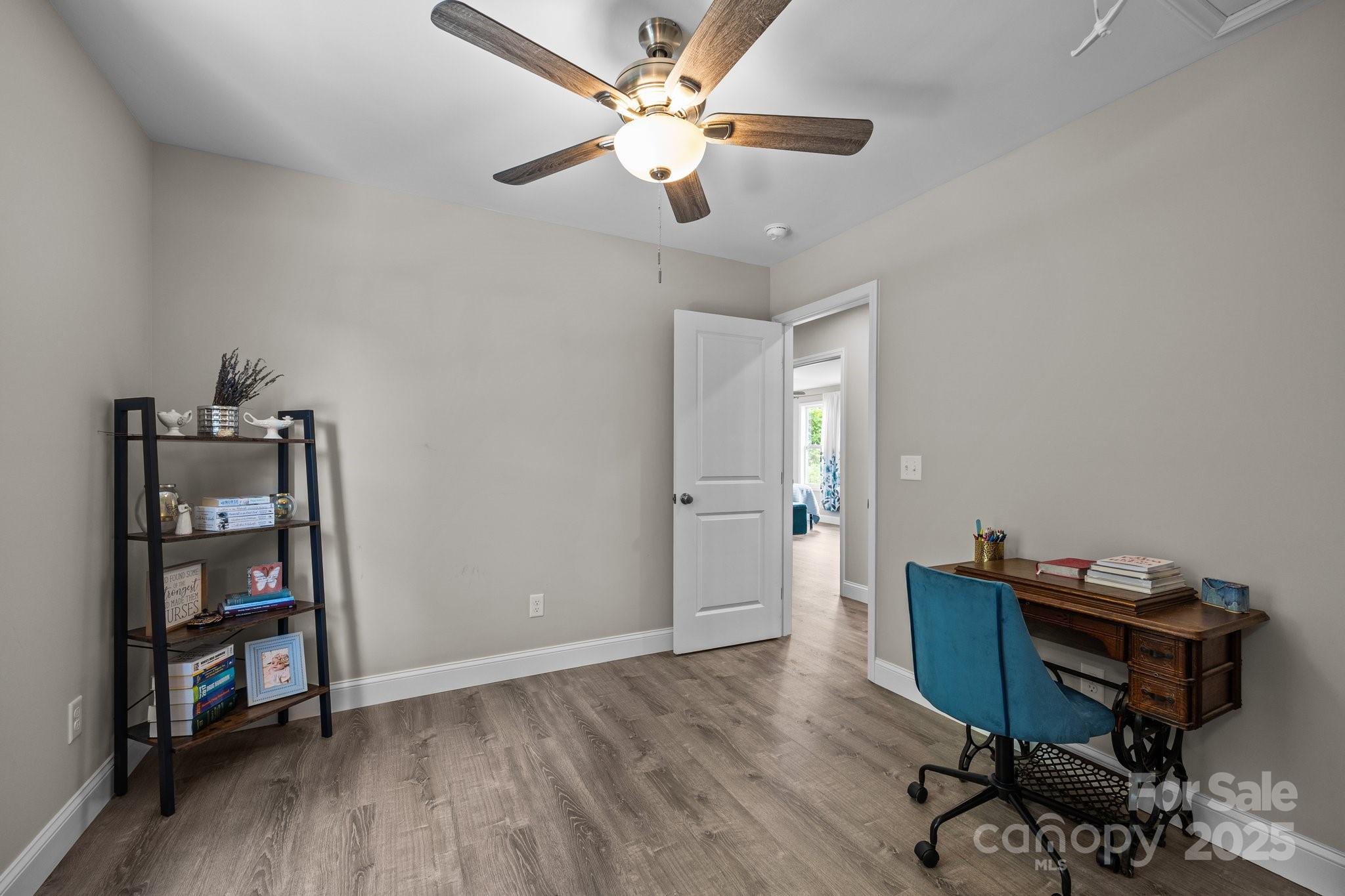458 Summer Road Hendersonville, NC 28792 - Photo 22 of 29 a view of a workspace with furniture and a window
