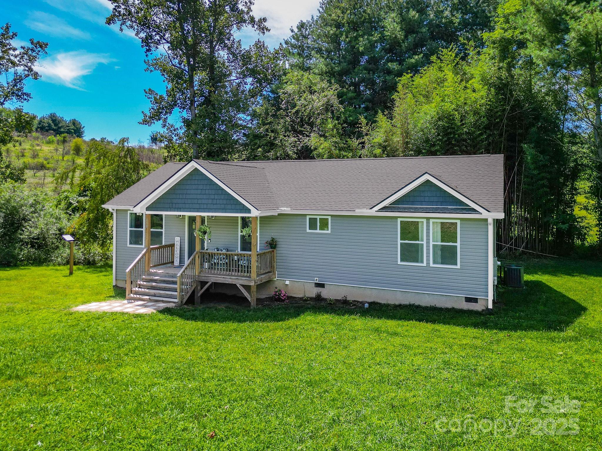 458 Summer Road Hendersonville, NC 28792 - Photo 25 of 29 a front view of a house with a garden